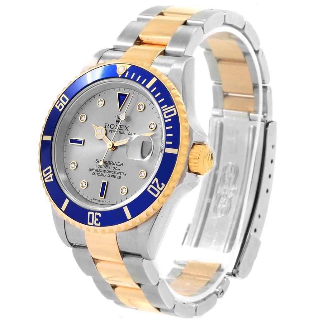 The Rolex Submariner 16613 Men's Steel and Gold (two tone) Grey Dial 16613 Men's Steel and Gold (two tone) Grey Dial watch is shown at a slight angle, highlighting the face, bezel, crown, and two-tone metal bracelet.