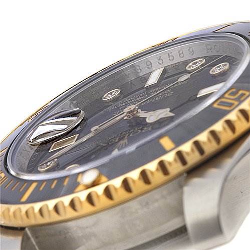 The image shows a close-up, angled view of the Rolex Submariner 116613 Men's Yellow Gold Black Dial 116613 Men's Yellow Gold Black Dial watch, focusing on its dial, bezel, and part of the case.