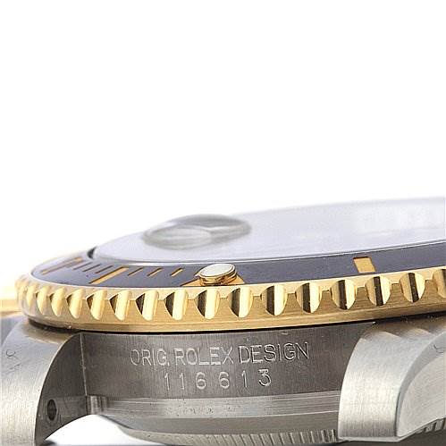 This side view of a Rolex Submariner 116613 Men's Yellow Gold Black Dial 116613 Men's Yellow Gold Black Dial shows the case, bezel, and part of the inscription with the model number 116613.