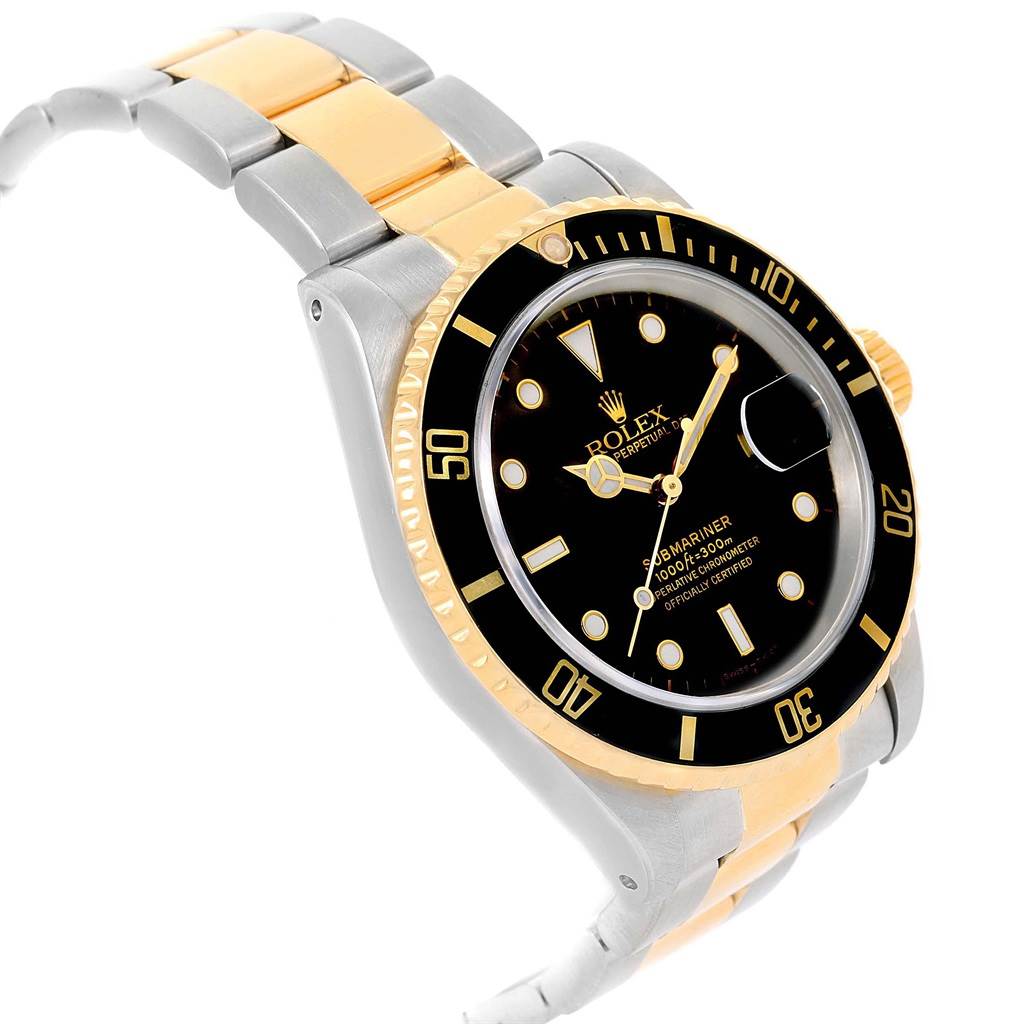 The Rolex Submariner 16613 Men's Steel and Gold (two tone) Black Dial 16613 Men's Steel and Gold (two tone) Black Dial watch is shown at an angle highlighting its face, bezel, and two-tone bracelet.