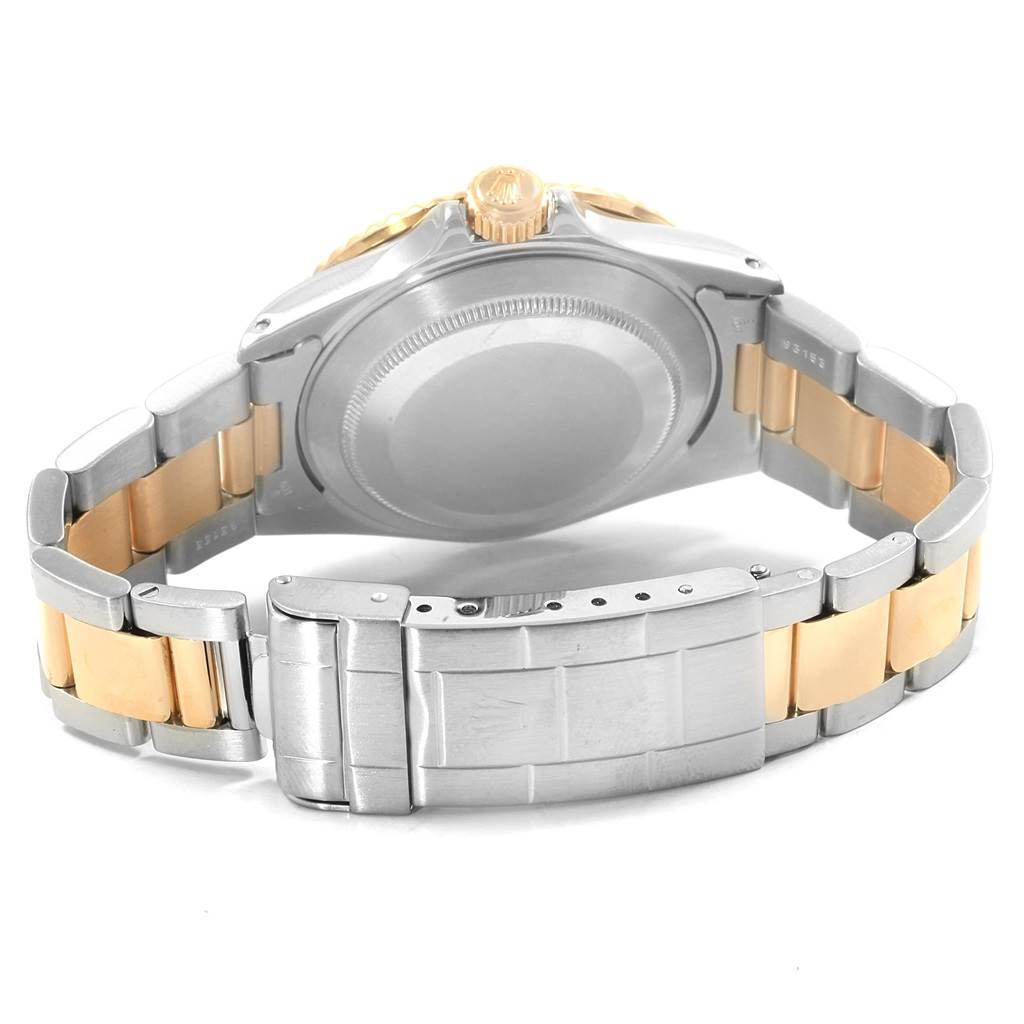 The image shows the back view of a Rolex Submariner 16613 Men's Steel and Gold (two tone) Black Dial 16613 Men's Steel and Gold (two tone) Black Dial, focusing on the case back and two-tone metal bracelet.