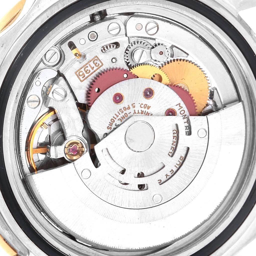 The image shows the internal mechanical movement of a Rolex Submariner 16613 Men's Steel and Gold (two tone) Black Dial 16613 Men's Steel and Gold (two tone) Black Dial watch from a close-up top-down angle.