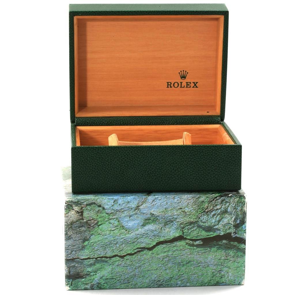 The image shows an open green and wooden Rolex Submariner 16613 Men's Steel and Gold (two tone) Black Dial 16613 Men's Steel and Gold (two tone) Black Dial watch box from the front.