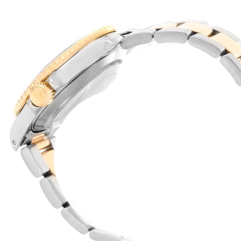 This image shows a side view of the Rolex Submariner 16613 Men's Steel and Gold (two tone) Black Dial 16613 Men's Steel and Gold (two tone) Black Dial, highlighting the crown, bezel, and part of the bracelet.