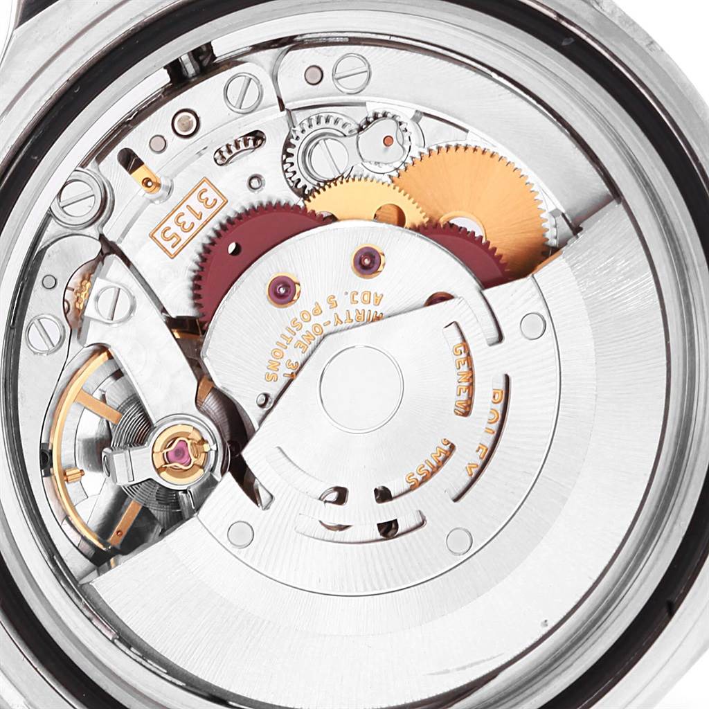 The image shows an interior view of the Rolex Submariner 16610LV Men's Stainless Steel Black Dial 16610LV Men's Stainless Steel Black Dial's movement, revealing the intricate gears and mechanisms.