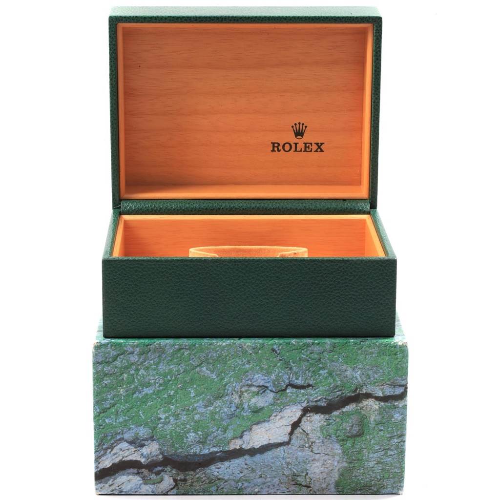 This image shows an open green Rolex watch box with a beige interior, designed for the Submariner model.