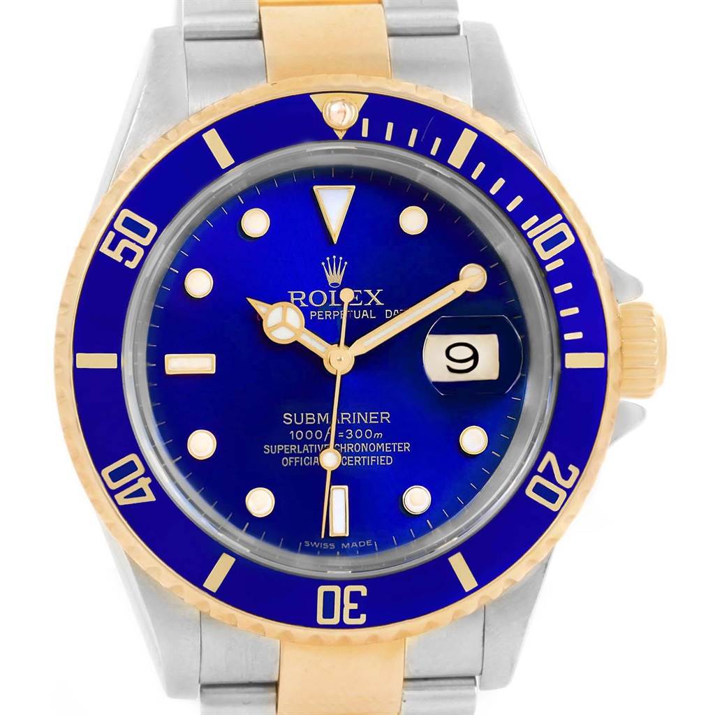 The Rolex Submariner 16613 Men's Steel and Gold (two tone) Blue Dial 16613 Men's Steel and Gold (two tone) Blue Dial watch is shown from a front view, displaying the dial, bezel, and part of the bracelet.