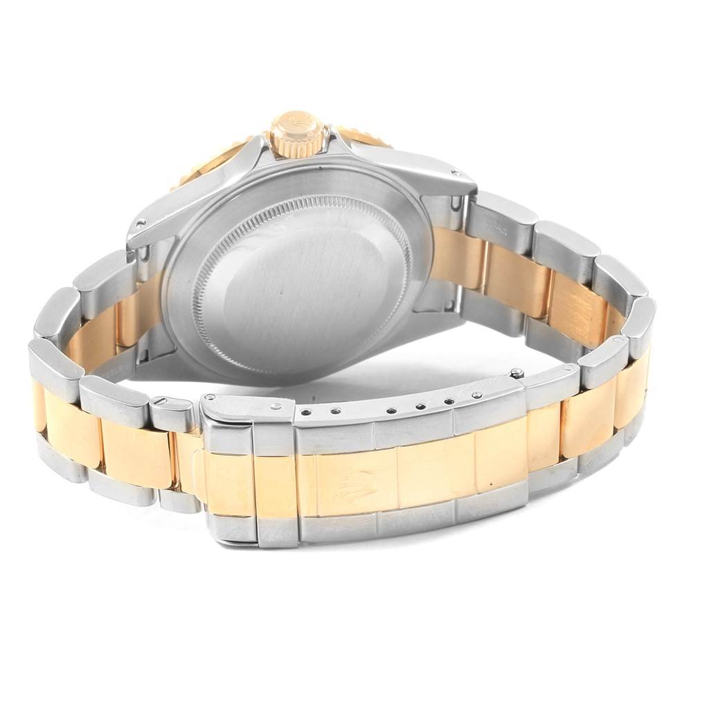 This image shows the back case and bracelet of a Rolex Submariner 16613 Men's Steel and Gold (two tone) Blue Dial 16613 Men's Steel and Gold (two tone) Blue Dial, viewed from the rear.