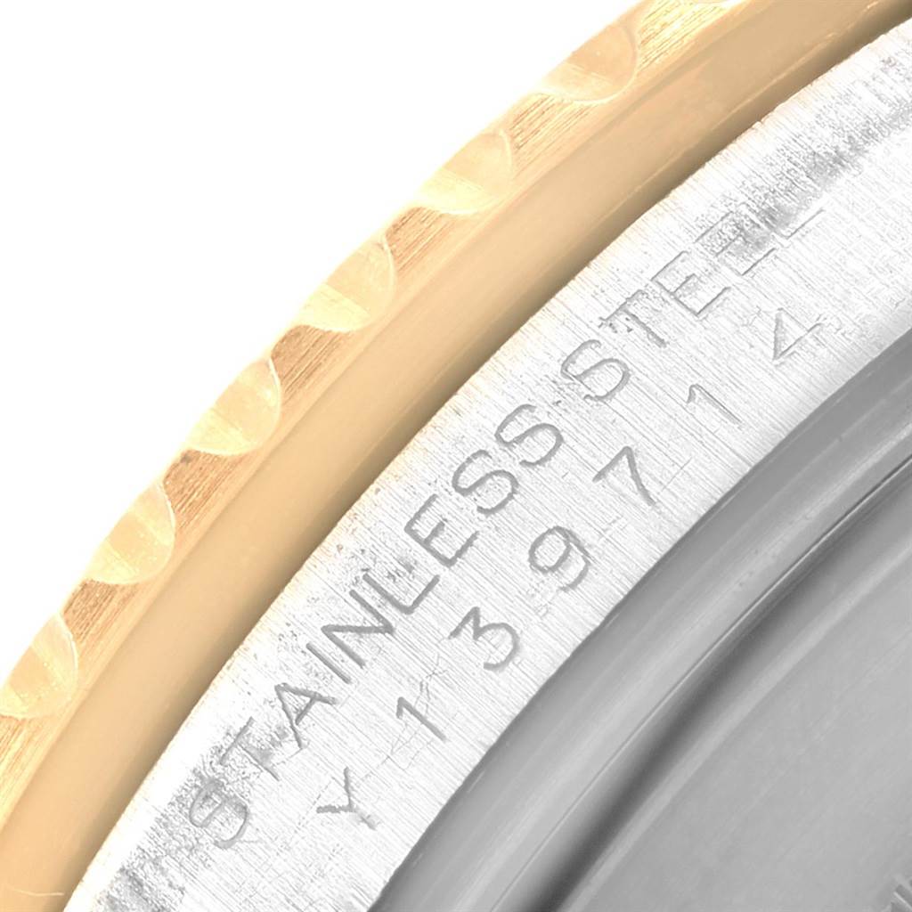 A close-up view of the back case details and bezel of the Rolex Submariner 16613 Men's Steel and Gold (two tone) Blue Dial 16613 Men's Steel and Gold (two tone) Blue Dial watch.