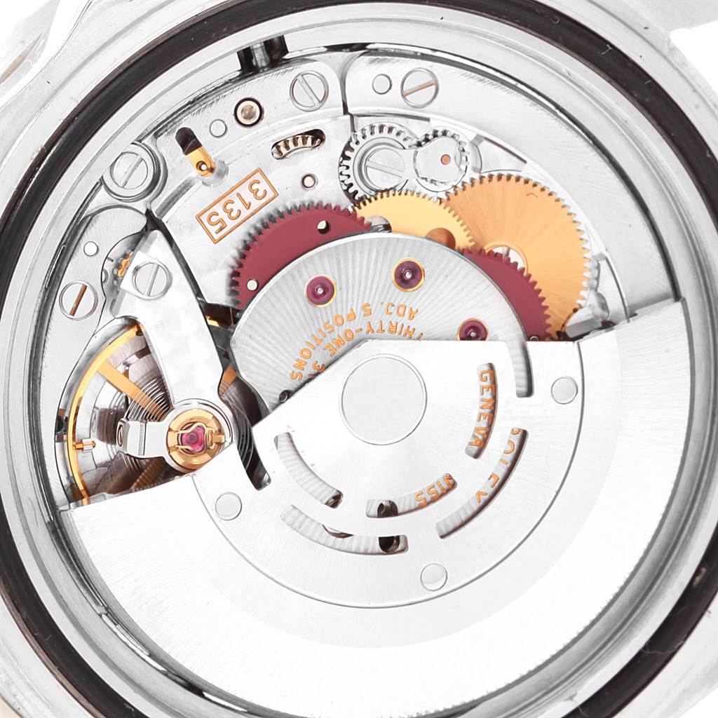 This image shows a close-up of the internal mechanism of a Rolex Submariner 16610 Men
s Stainless Steel Black Dial 16610 Men
s Stainless Steel Black Dial, highlighting gears and movement components.