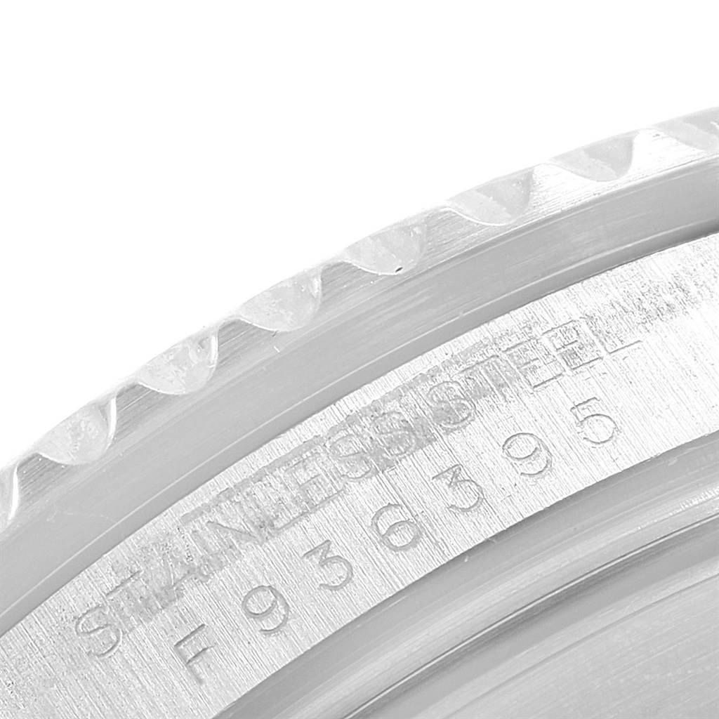 The image shows a close-up of the bezel and stainless steel engravings on a Rolex Submariner 16610 Men
s Stainless Steel Black Dial 16610 Men
s Stainless Steel Black Dial watch.