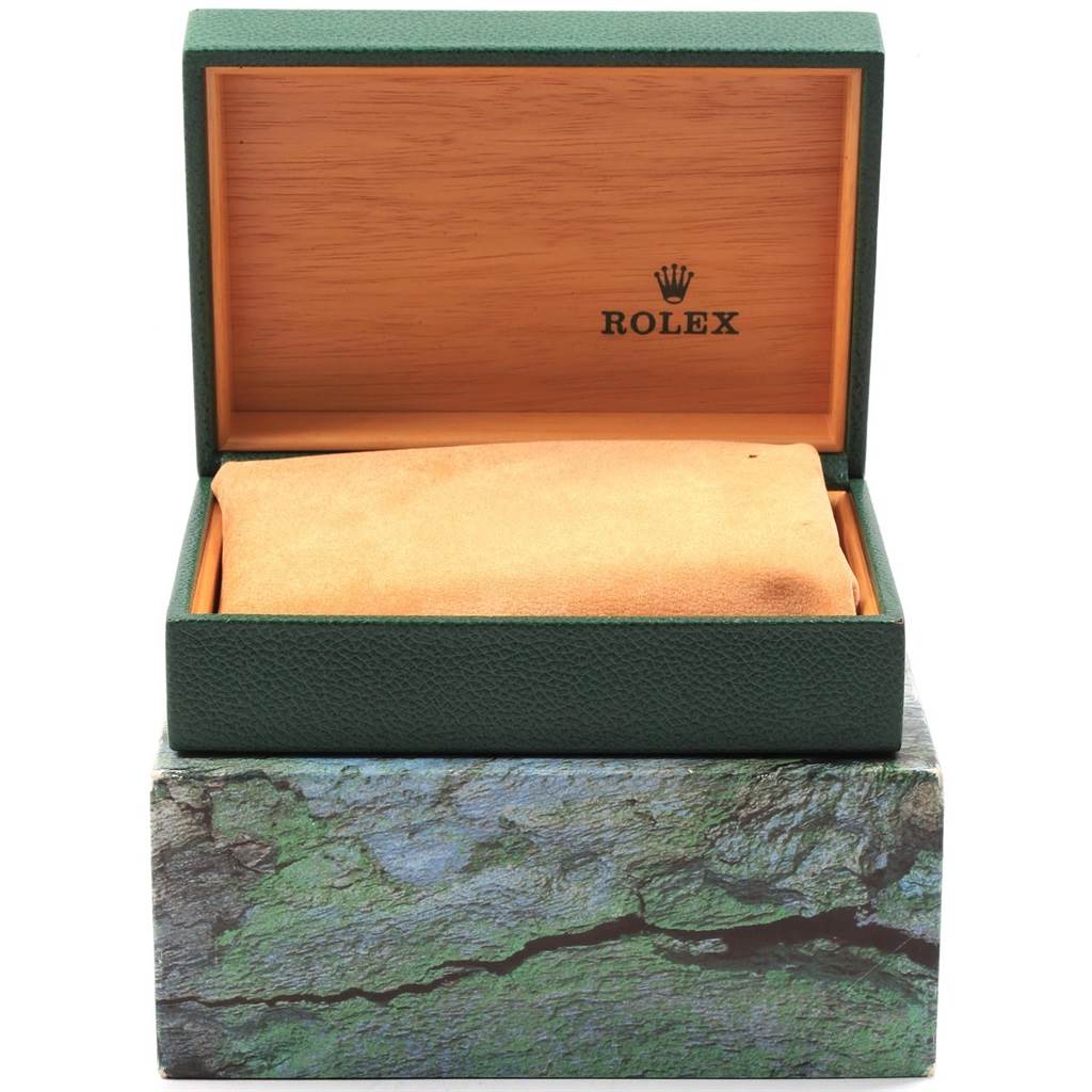 The image shows an open Rolex Submariner 16610 Men
s Stainless Steel Black Dial 16610 Men
s Stainless Steel Black Dial watch box, revealing the interior lining and cushion.