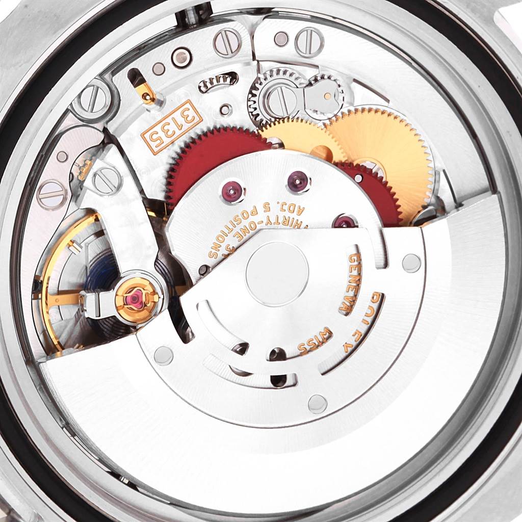 The image shows the internal movement and gears of a Rolex Submariner 116610LV Men
s Stainless Steel Green Dial 116610LV Men
s Stainless Steel Green Dial watch from a top-down angle.