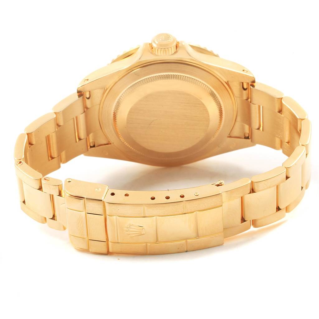 The image shows the backside and clasp of a Rolex Submariner 16618 Men's Yellow Gold Blue Dial 16618 Men's Yellow Gold Blue Dial watch at a rear-facing angle.