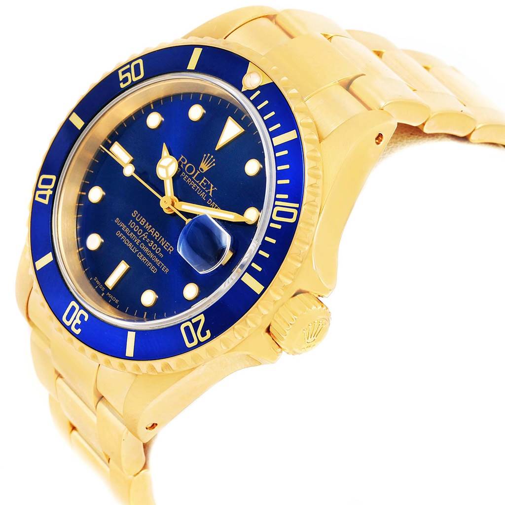 The Rolex Submariner 16618 Men's Yellow Gold Blue Dial 16618 Men's Yellow Gold Blue Dial watch is shown at an angled side view, highlighting its blue dial, bezel, and gold bracelet.