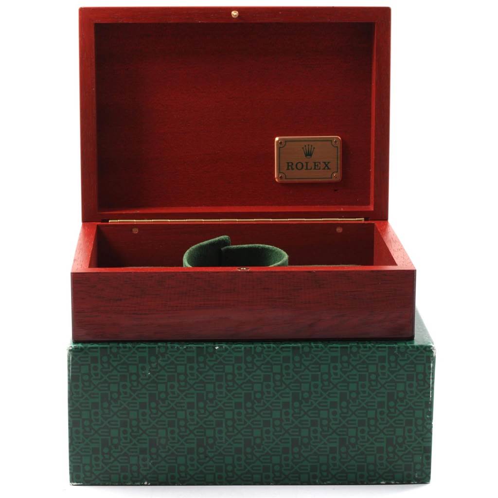 This image shows an open box for a Rolex Submariner 16618 Men's Yellow Gold Blue Dial 16618 Men's Yellow Gold Blue Dial watch, angled from the front with visible interior and logo tag.