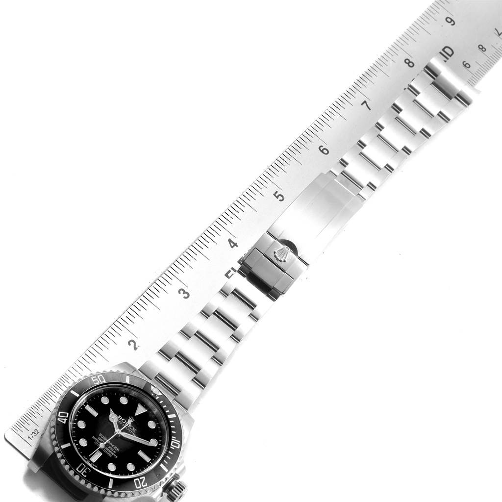 The image shows a Rolex Submariner 114060 Men's Stainless Steel Black Dial 114060 Men's Stainless Steel Black Dial watch laid flat with a ruler measuring its bracelet length.