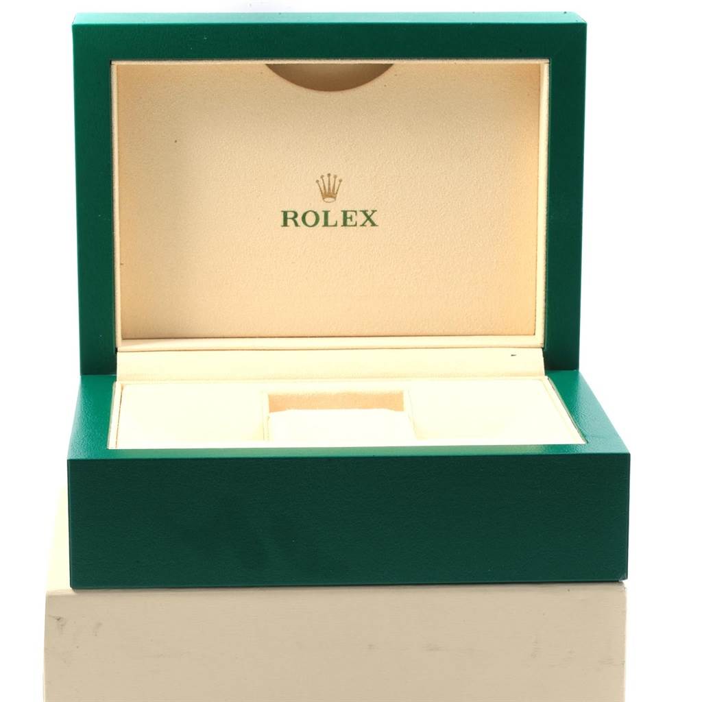 This image shows an open green-and-beige Rolex watch box for the Submariner model, viewed from the front.