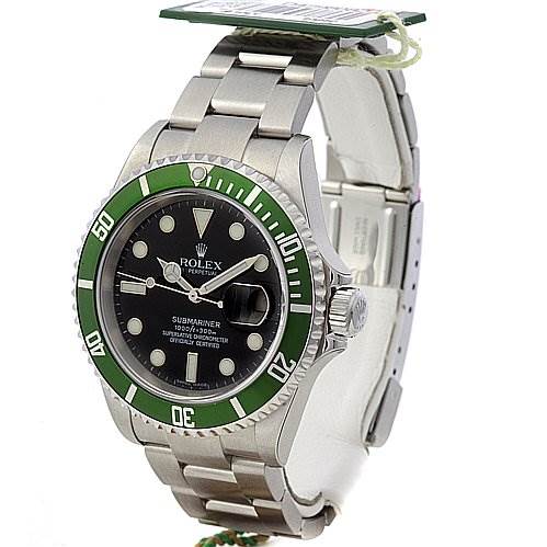 The image shows a side and front angle of a Rolex Submariner 16610LV Men's Stainless Steel Black Dial 16610LV Men's Stainless Steel Black Dial watch, highlighting its green bezel, black dial, and stainless steel bracelet.