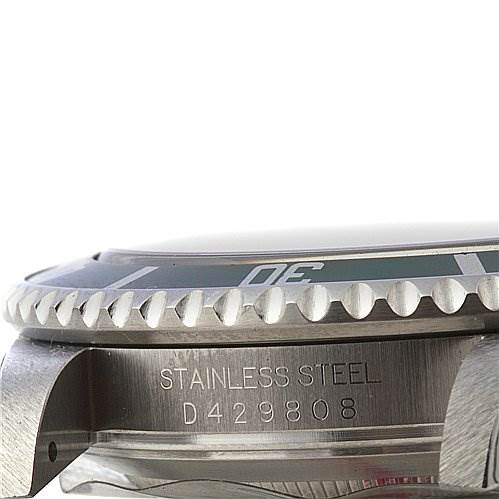 This image shows a close-up side view of the bezel, stainless steel case, and serial number on a Rolex Submariner 16610LV Men's Stainless Steel Black Dial 16610LV Men's Stainless Steel Black Dial watch.