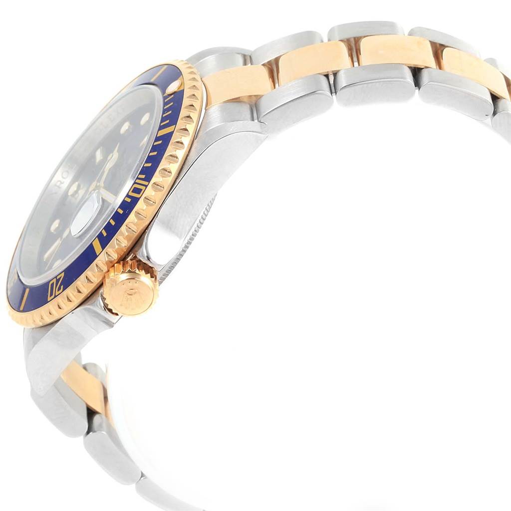 This image shows a side profile of a Rolex Submariner 16613 Men's Steel and Gold (two tone) Blue Dial 16613 Men's Steel and Gold (two tone) Blue Dial, highlighting its bezel, crown, and two-tone bracelet.