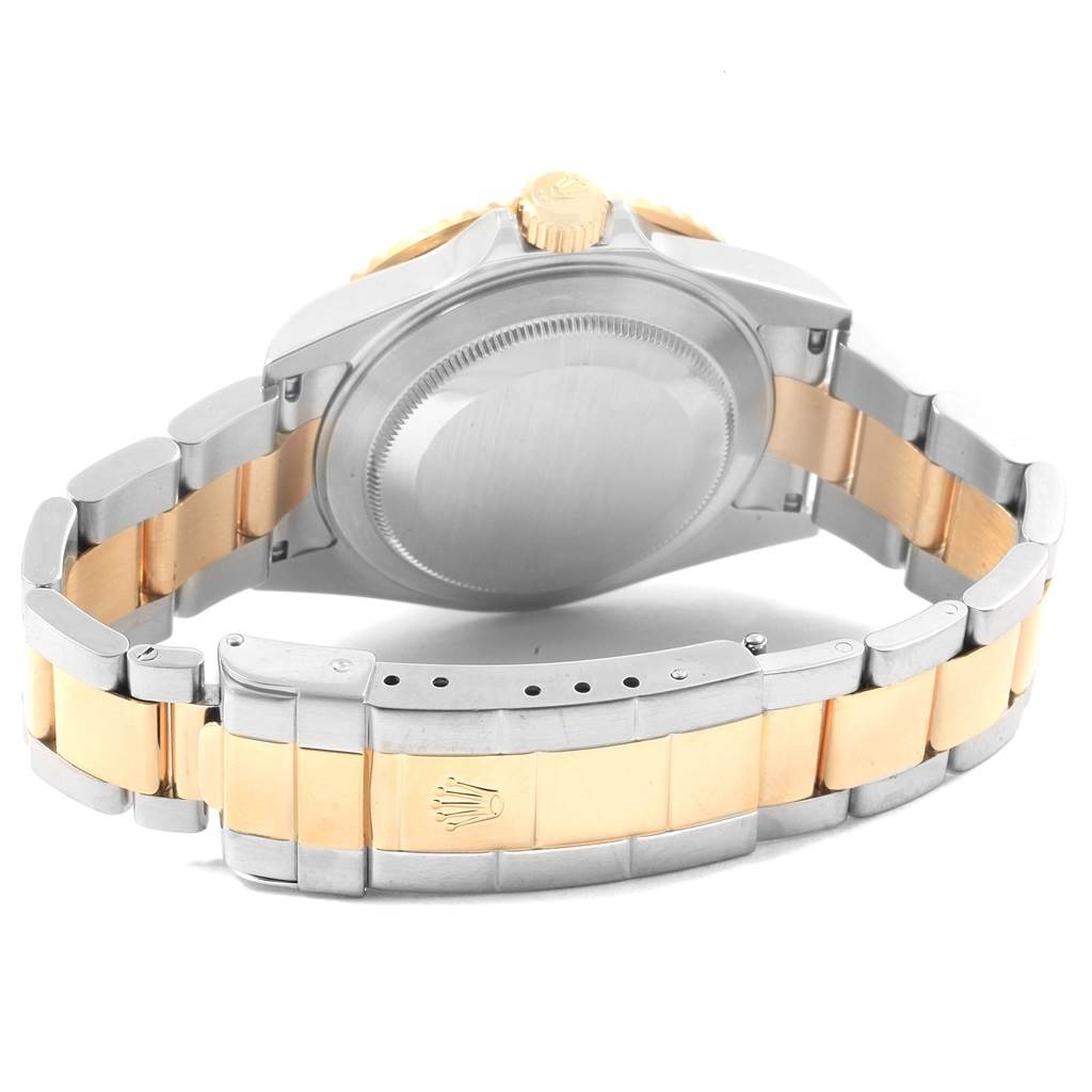 This image shows the back case and bracelet of a Rolex Submariner 16613 Men's Steel and Gold (two tone) Blue Dial 16613 Men's Steel and Gold (two tone) Blue Dial watch.