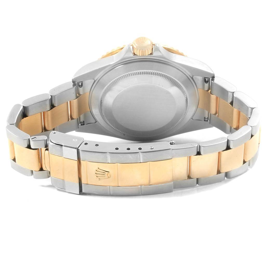 The image shows the back and bracelet of a Rolex Submariner 16613 Men's Steel and Gold (two tone) Black Dial 16613 Men's Steel and Gold (two tone) Black Dial watch, highlighting the two-tone metal links and the clasp.