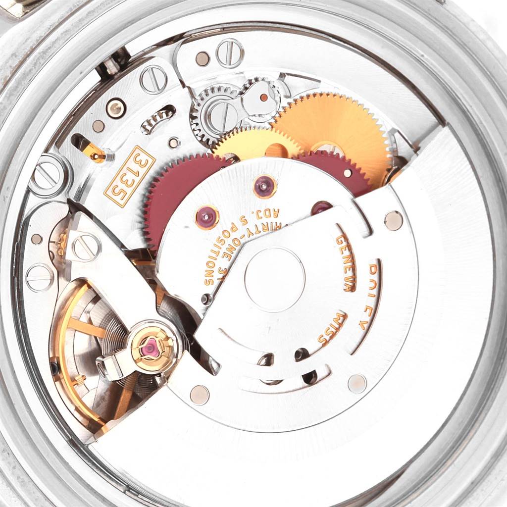 This image shows a close-up of the intricate inner mechanical parts of a Rolex Submariner 16610 Men's Stainless Steel Black Dial 16610 Men's Stainless Steel Black Dial watch movement.