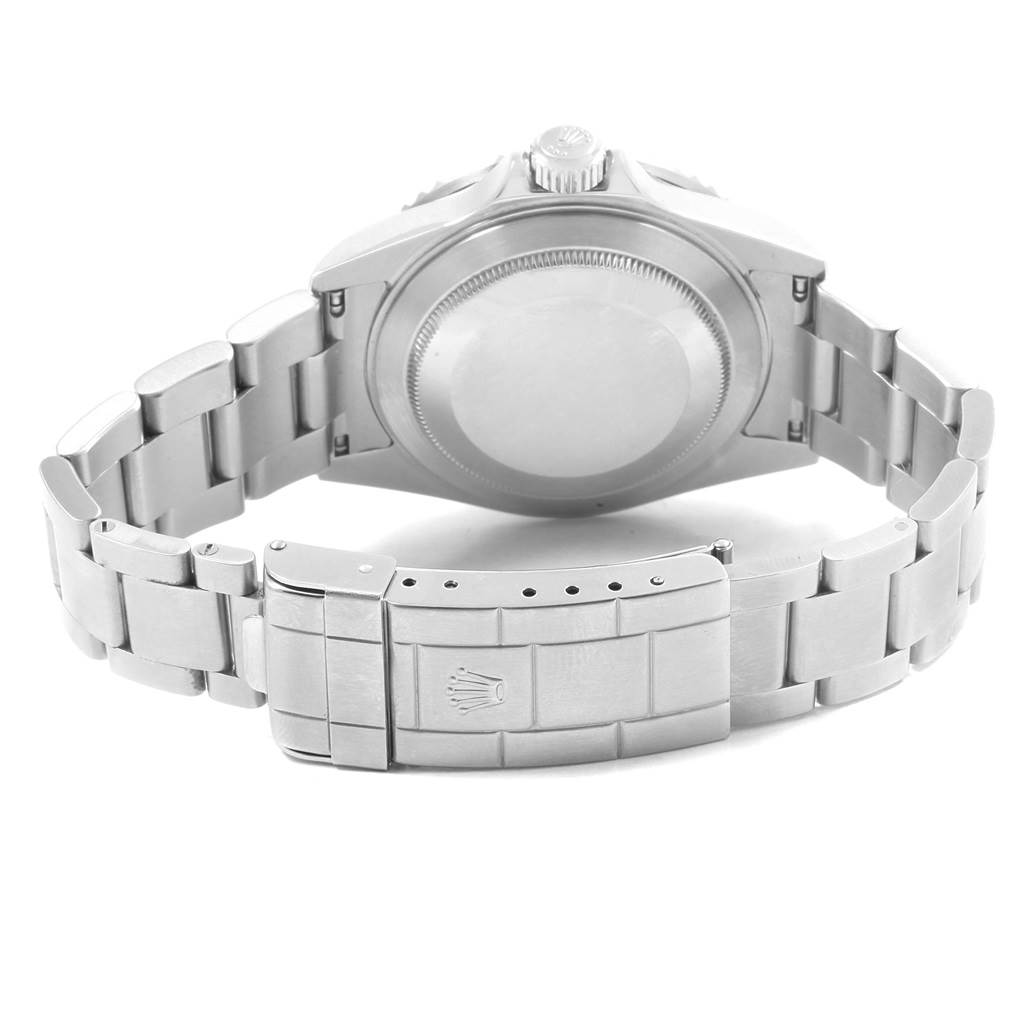 The image shows the back view of a Rolex Submariner 16610 Men's Stainless Steel Black Dial 16610 Men's Stainless Steel Black Dial watch, highlighting the case back and bracelet with the clasp.