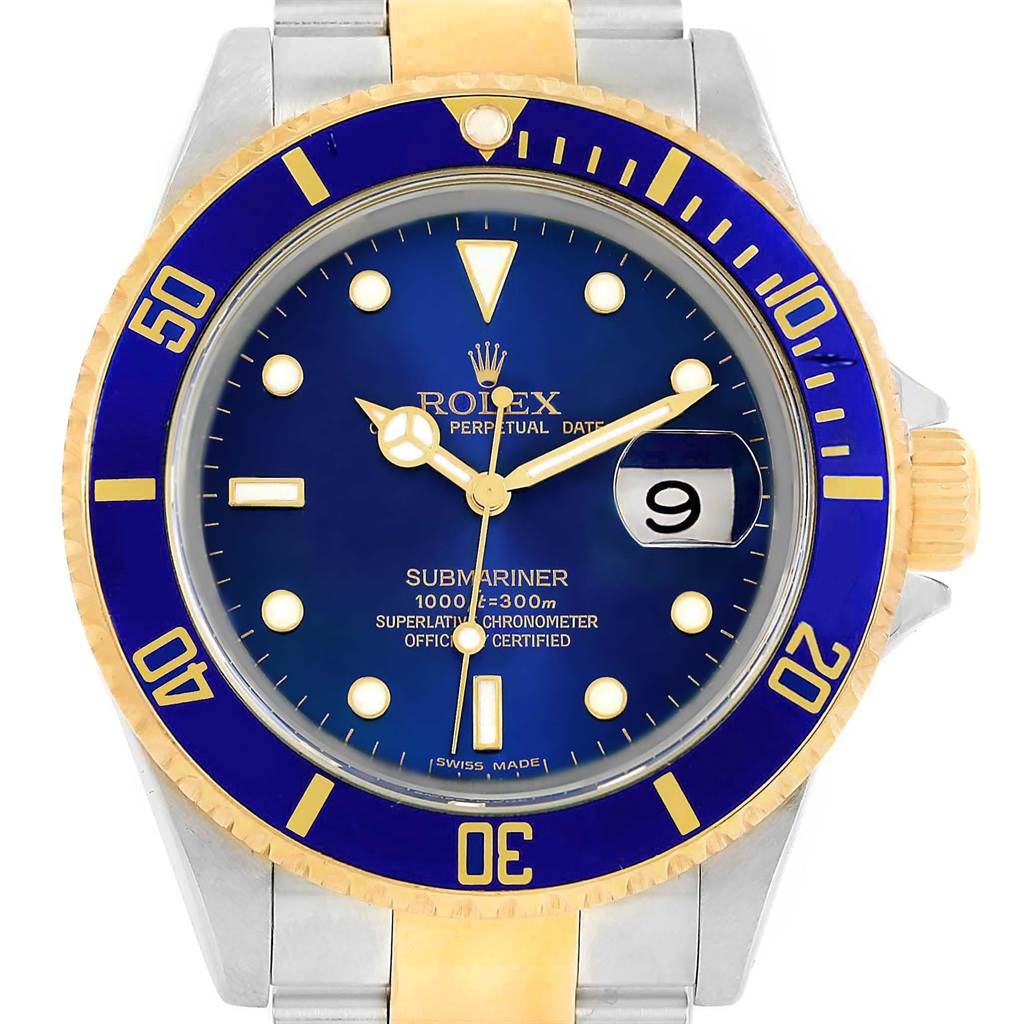 The image shows a front angle view of the Rolex Submariner 16613 Men's Steel and Gold (two tone) Blue Dial 16613 Men's Steel and Gold (two tone) Blue Dial watch, highlighting its blue dial, golden accents, and two-tone metal bracelet.