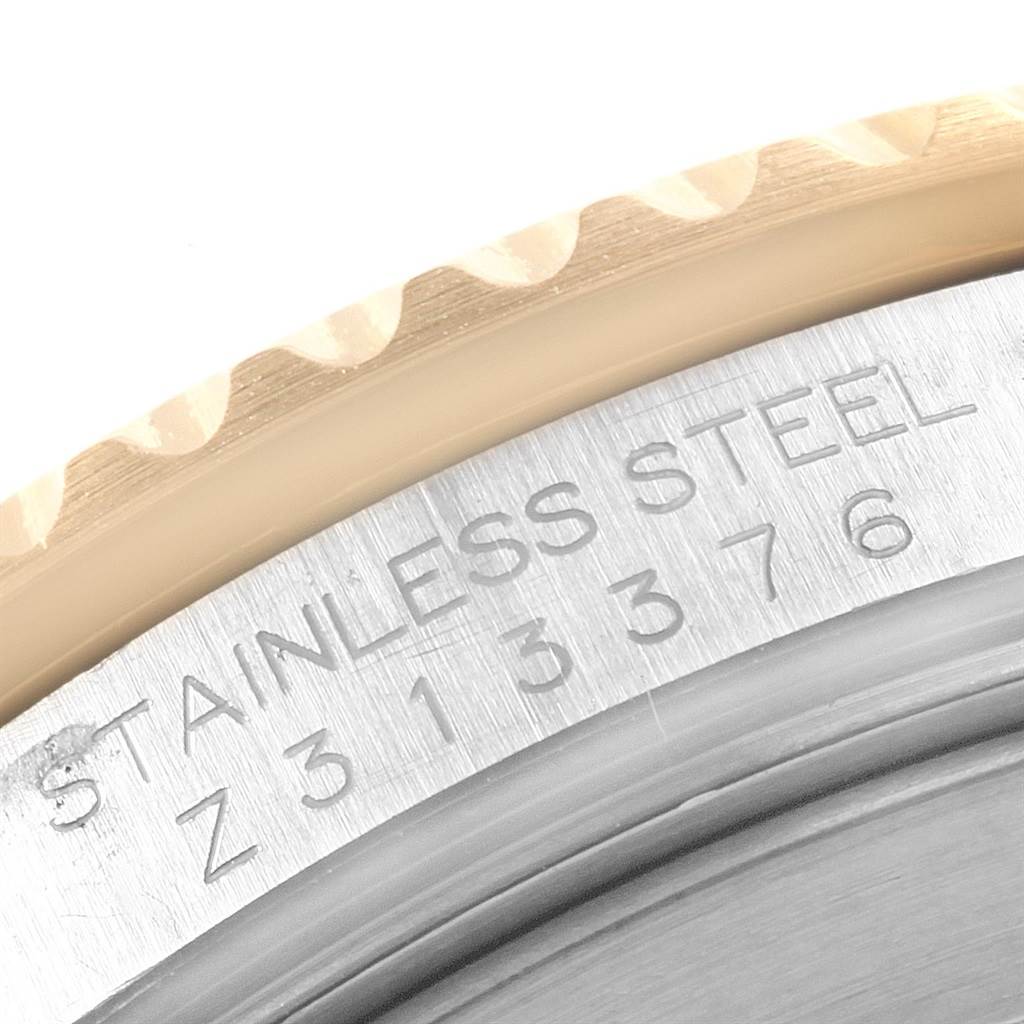 The image shows the edge of the bezel and the engraved serial number of a Rolex Submariner 16613 Men's Steel and Gold (two tone) Blue Dial 16613 Men's Steel and Gold (two tone) Blue Dial watch.