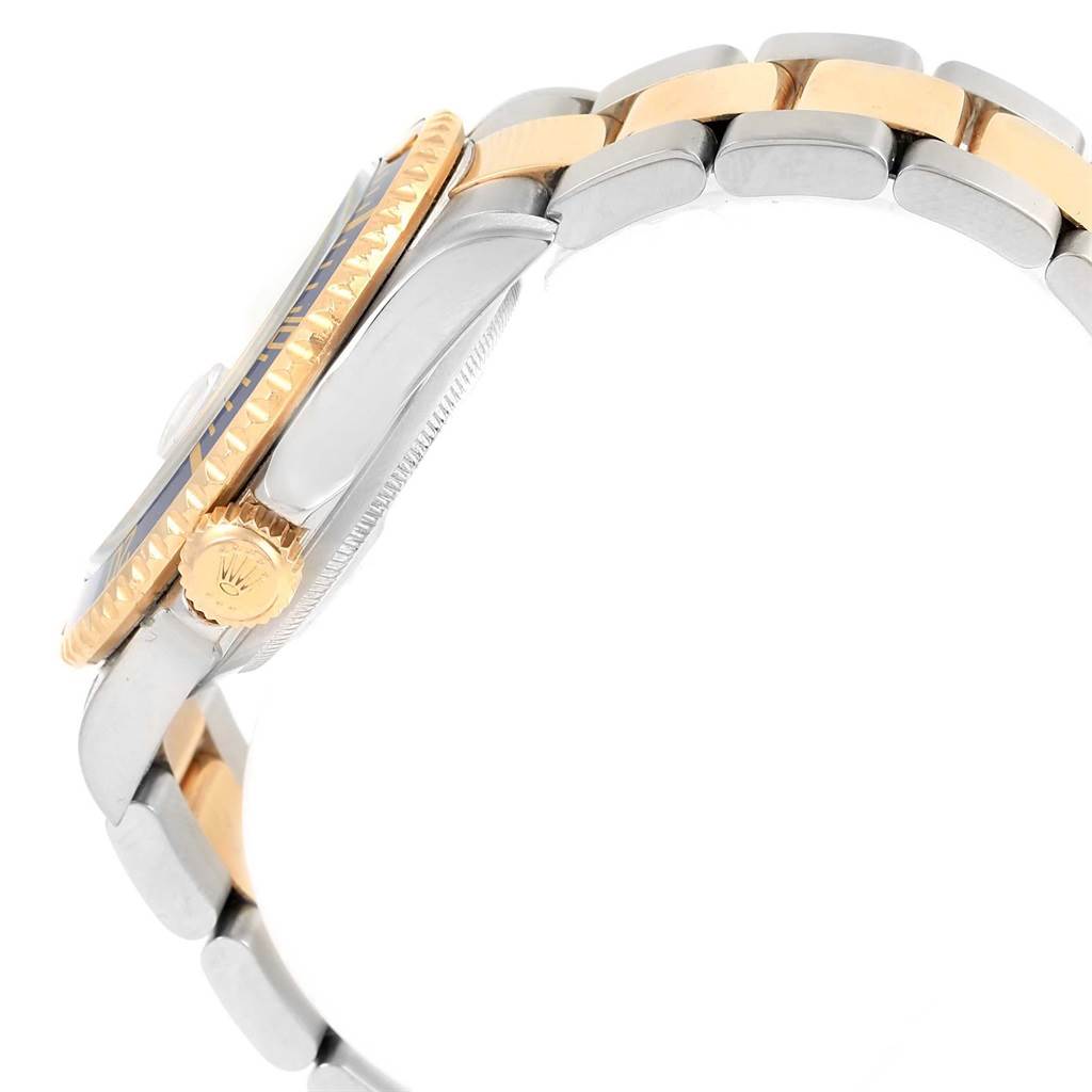 The image shows the side view of a Rolex Submariner 16613 Men's Steel and Gold (two tone) Blue Dial 16613 Men's Steel and Gold (two tone) Blue Dial, highlighting its crown, bezel, and bracelet.