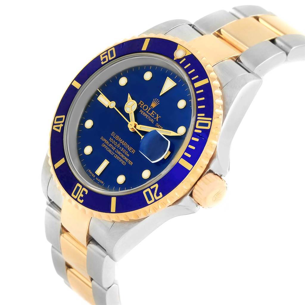 This image shows a Rolex Submariner 16613 Men's Steel and Gold (two tone) Blue Dial 16613 Men's Steel and Gold (two tone) Blue Dial watch at an angle highlighting the dial, bezel, and partially the bracelet.
