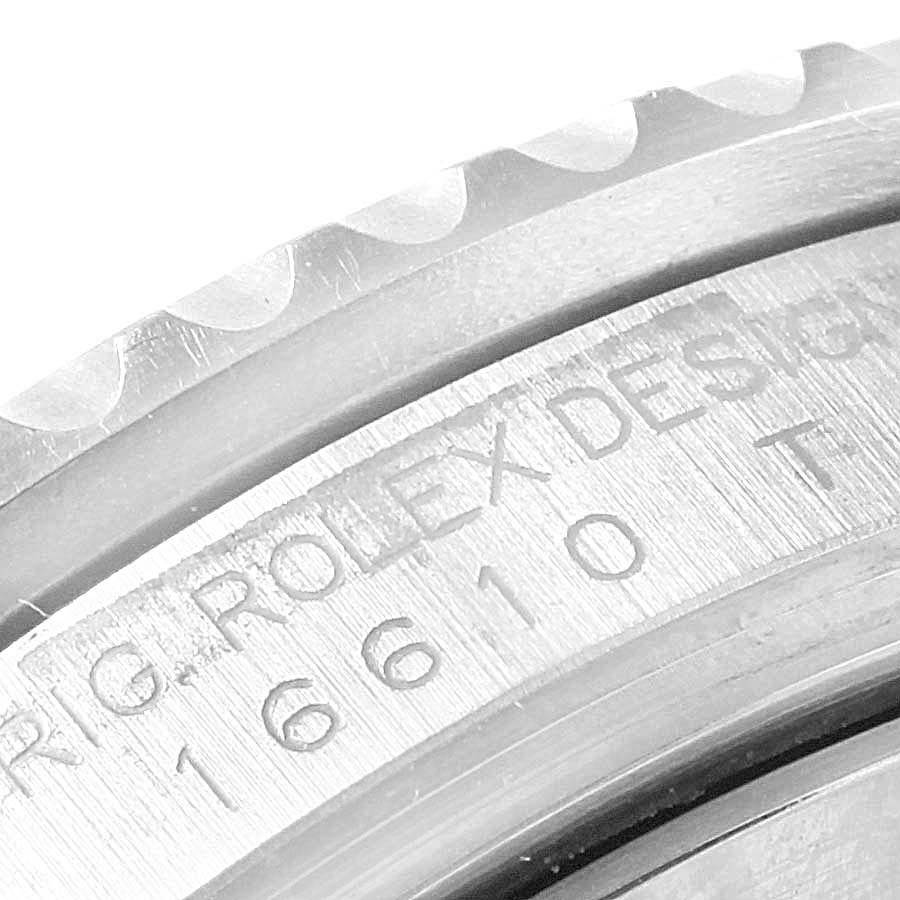 This image shows a close-up of the bezel and casing of a Rolex Submariner 16610LV Men's Stainless Steel Black Dial 16610LV Men's Stainless Steel Black Dial model, highlighting the Rolex engraving and model number.