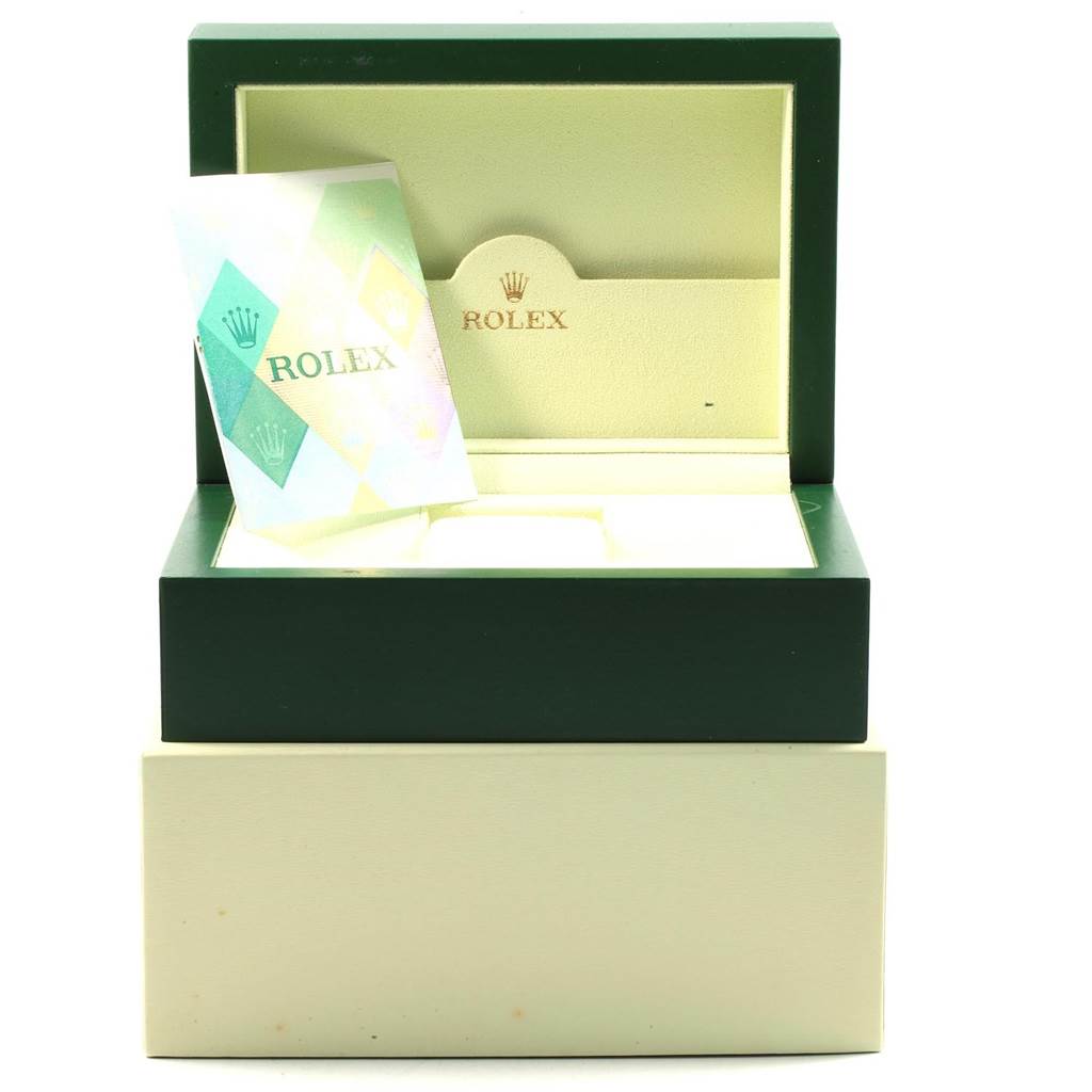 The image shows an open Rolex Submariner 16610LV Men's Stainless Steel Black Dial 16610LV Men's Stainless Steel Black Dial watch box, showcasing the inner compartment and a certificate/enclosure.