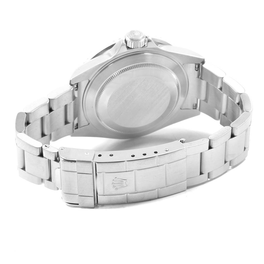 This image shows the back case and bracelet clasp of a Rolex Submariner 16610LV Men's Stainless Steel Black Dial 16610LV Men's Stainless Steel Black Dial watch in a partially open position.