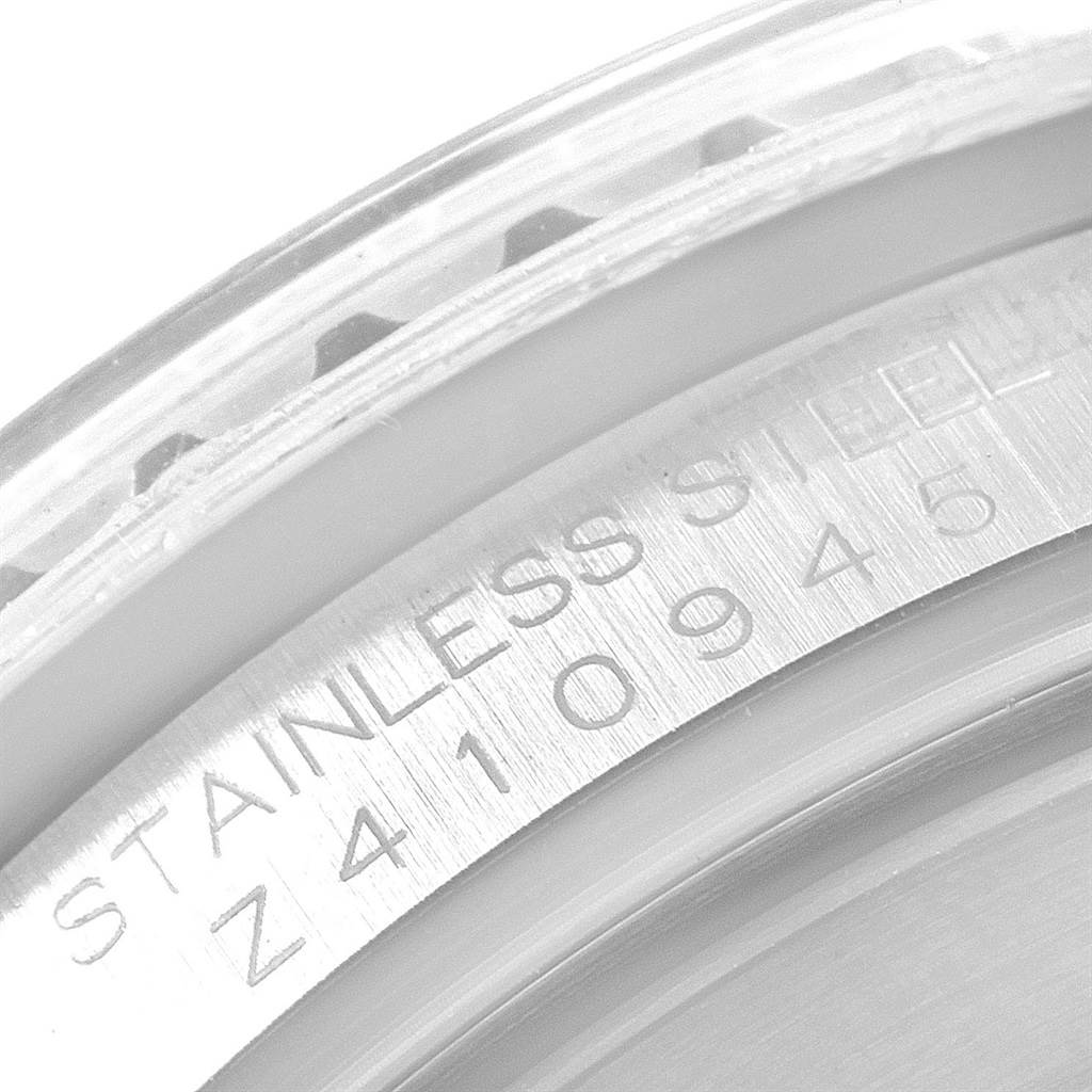 This image shows a close-up of the engravings on the stainless steel case back of a Rolex Submariner 16610LV Men's Stainless Steel Black Dial 16610LV Men's Stainless Steel Black Dial watch.