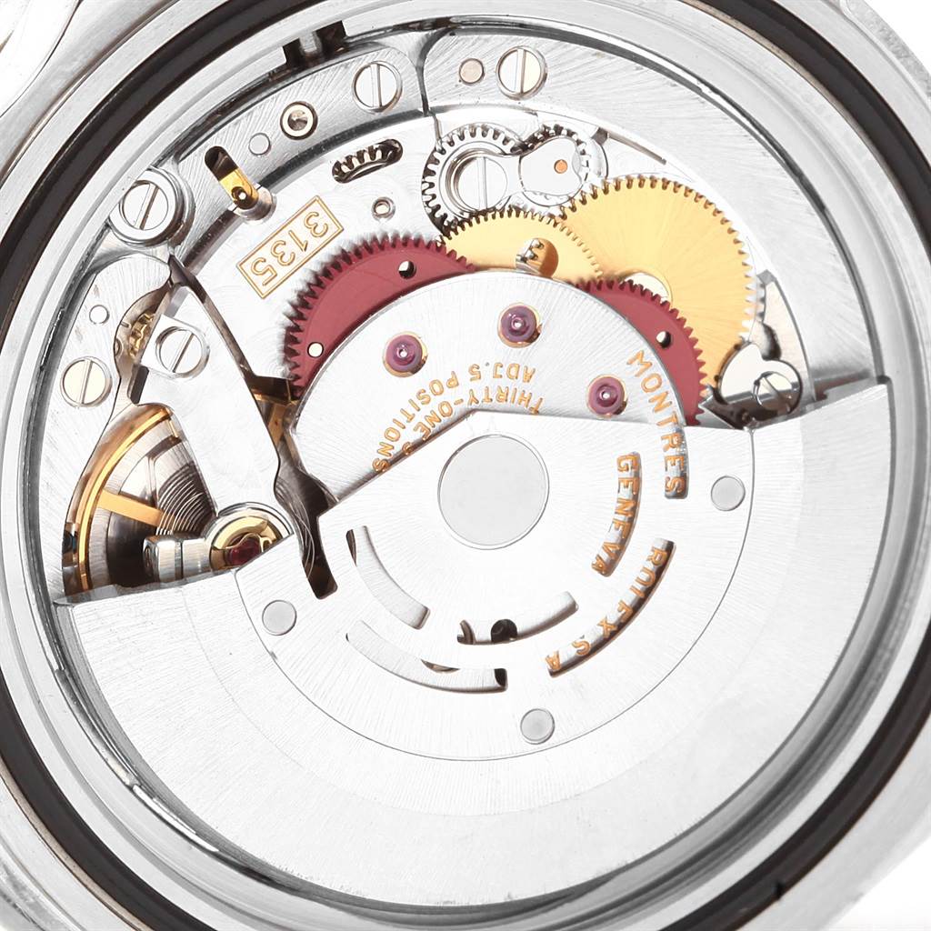 This image shows a close-up view of the movement mechanism of a Rolex Submariner 16610 Men's Stainless Steel Black Dial 16610 Men's Stainless Steel Black Dial watch.