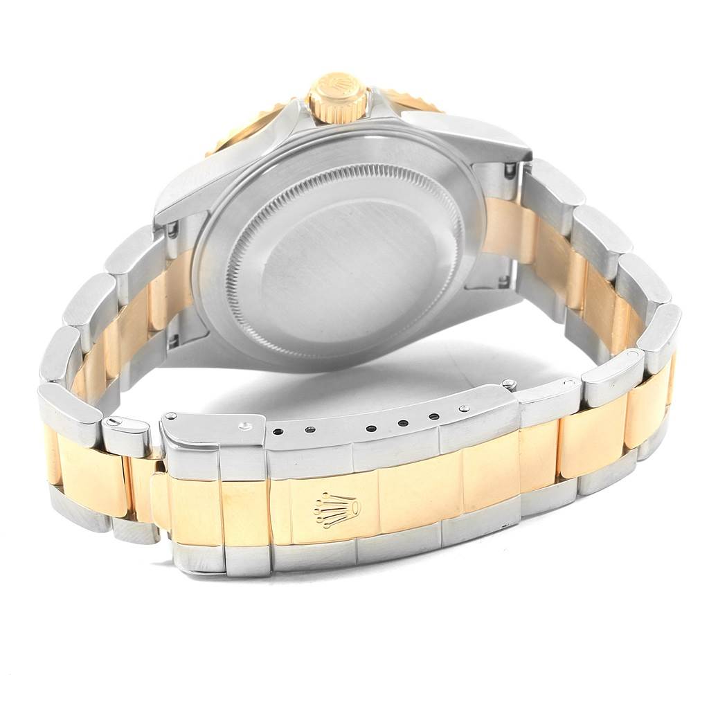 This is a rear view of a Rolex Submariner 16613 Men's Steel and Gold (two tone) Blue Dial 16613 Men's Steel and Gold (two tone) Blue Dial watch, showing the case back, crown, and two-tone bracelet with the clasp fully extended.