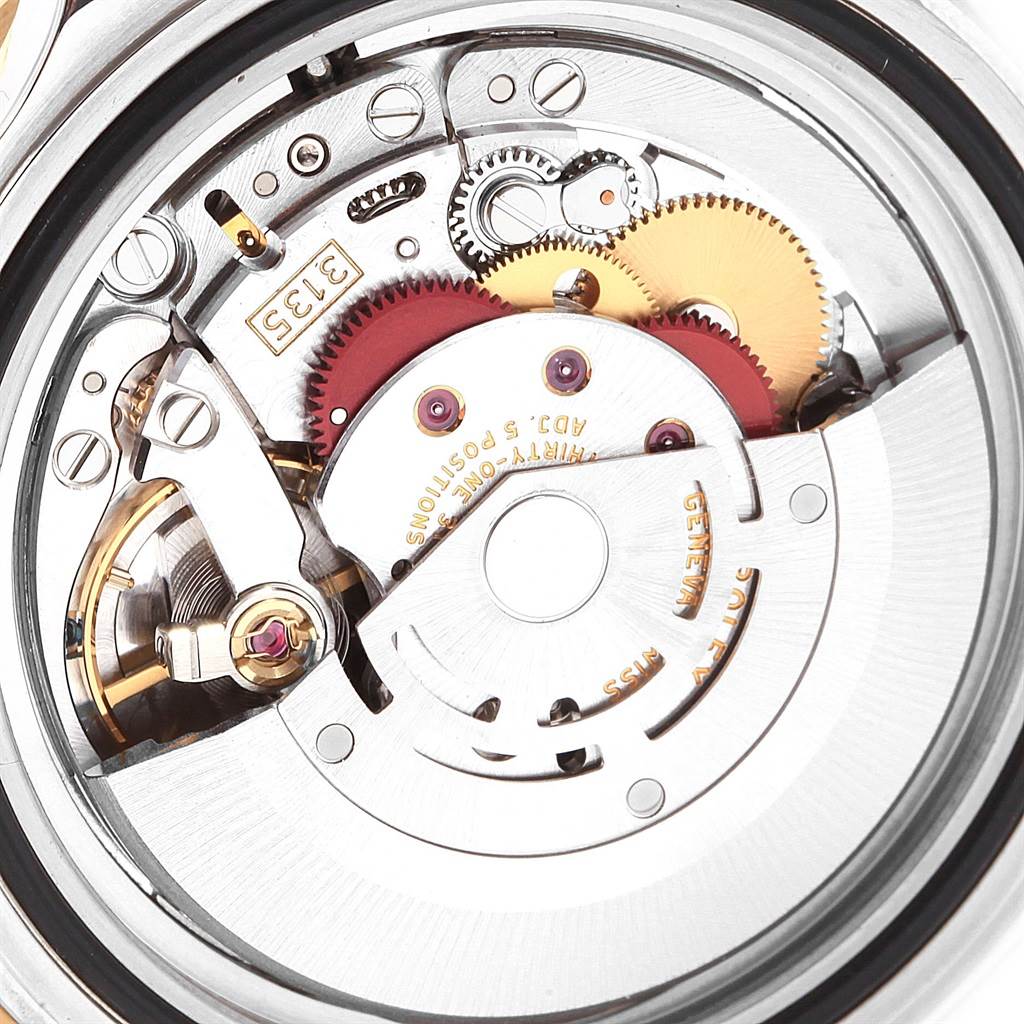 This image shows the intricate inner mechanism of the Rolex Submariner 16613 Men's Steel and Gold (two tone) Blue Dial 16613 Men's Steel and Gold (two tone) Blue Dial watch from a close-up, internal angle.