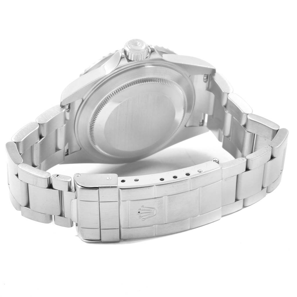 The image shows the backside of a Rolex Submariner 16610 Men's Stainless Steel Black Dial 16610 Men's Stainless Steel Black Dial watch, including the case back, bracelet, and clasp.