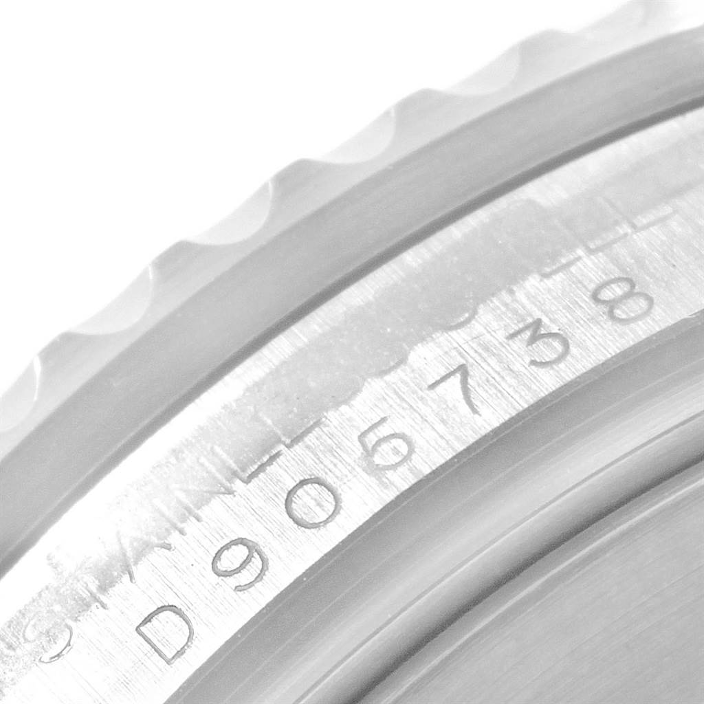 The image shows a close-up of the serialized edge of the bezel on a Rolex Submariner 16610 Men's Stainless Steel Black Dial 16610 Men's Stainless Steel Black Dial watch.