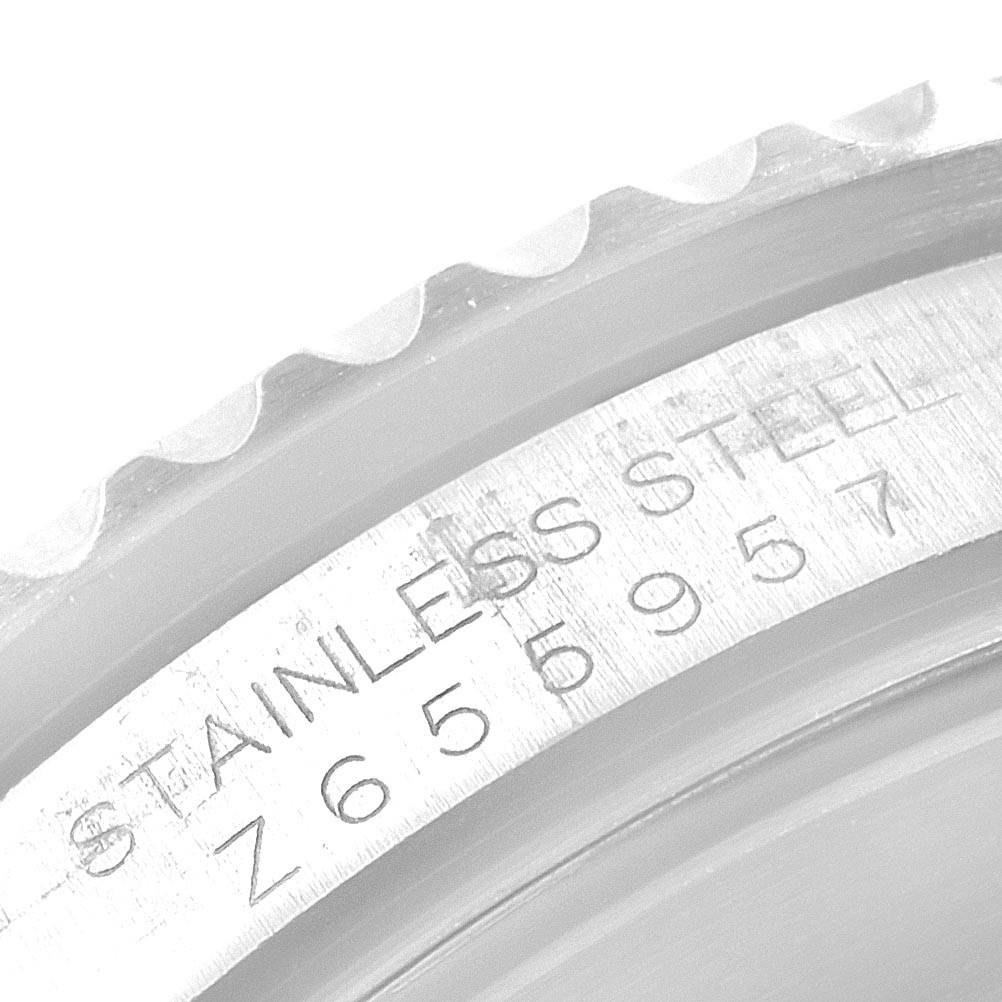 The image shows a close-up of the engraved stainless steel case of a Rolex Submariner 16610 Men's Stainless Steel Black Dial 16610 Men's Stainless Steel Black Dial watch.