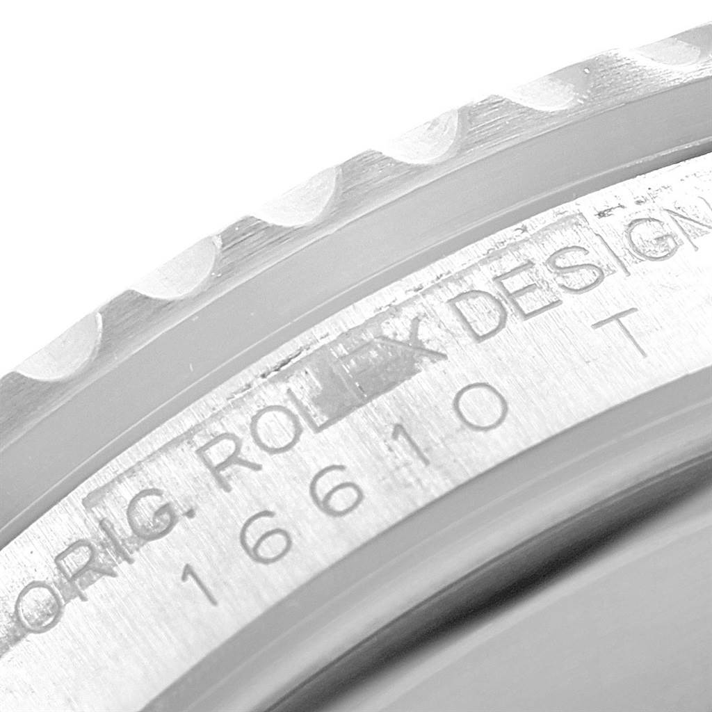 The image shows a close-up angle of the bezel and case engraving of a Rolex Submariner 16610 Men's Stainless Steel Black Dial 16610 Men's Stainless Steel Black Dial, displaying the model number and part of the brand name.