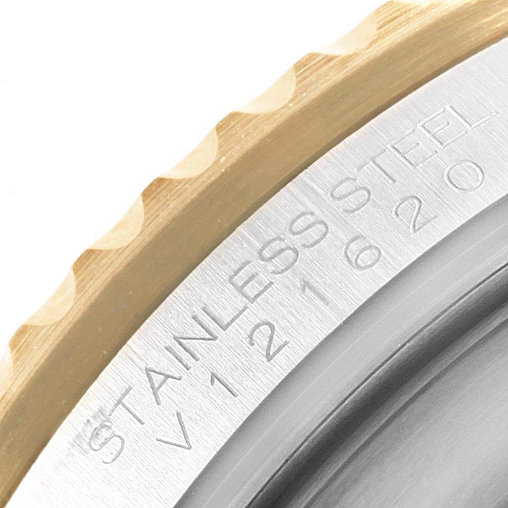 This is a close-up of the engraved stainless steel case back of a Rolex Submariner 16613 Men's Steel and Gold (two tone) Black Dial 16613 Men's Steel and Gold (two tone) Black Dial watch, showing part of the bezel.