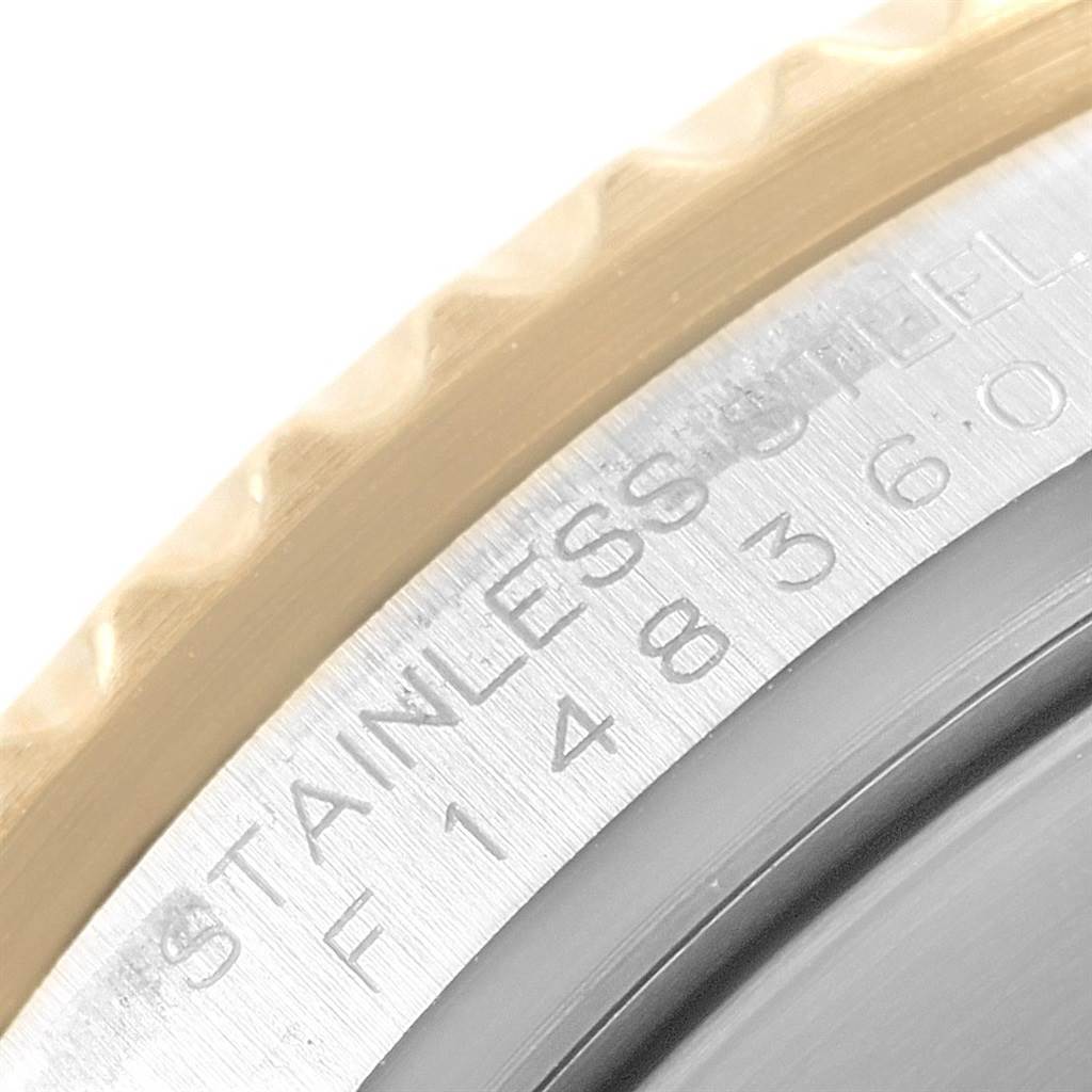 This image shows a close-up of the bezel and case edge of a Rolex Submariner 16613 Men's Steel and Gold (two tone) Grey Dial 16613 Men's Steel and Gold (two tone) Grey Dial watch.