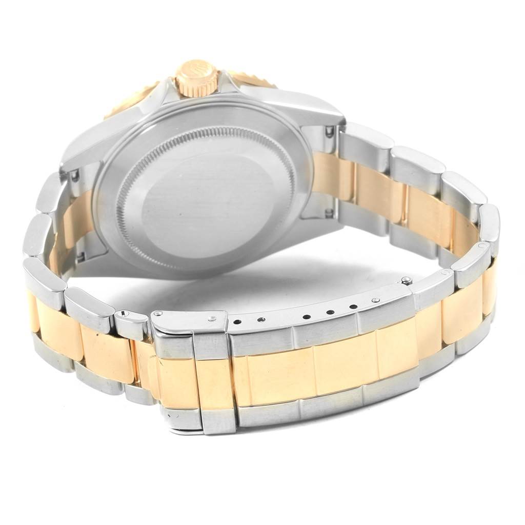 The image shows the back case and bracelet of a Rolex Submariner 16613 Men's Steel and Gold (two tone) Grey Dial 16613 Men's Steel and Gold (two tone) Grey Dial watch from a rear angle, displaying the clasp and gold accents.