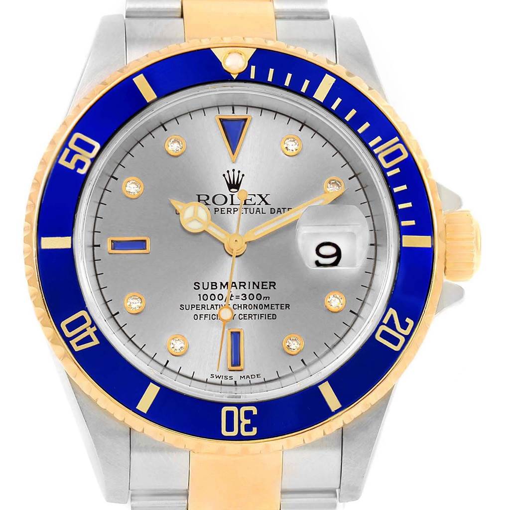 This image shows a frontal view of a Rolex Submariner 16613 Men's Steel and Gold (two tone) Grey Dial 16613 Men's Steel and Gold (two tone) Grey Dial watch, highlighting its blue bezel, silver face, and date display.