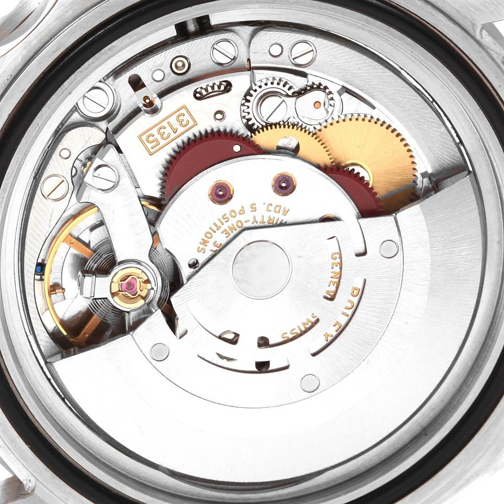 The image shows a close-up view of the inner movement and mechanical parts of a Rolex Submariner 16610 Men's Stainless Steel Black Dial 16610 Men's Stainless Steel Black Dial watch.