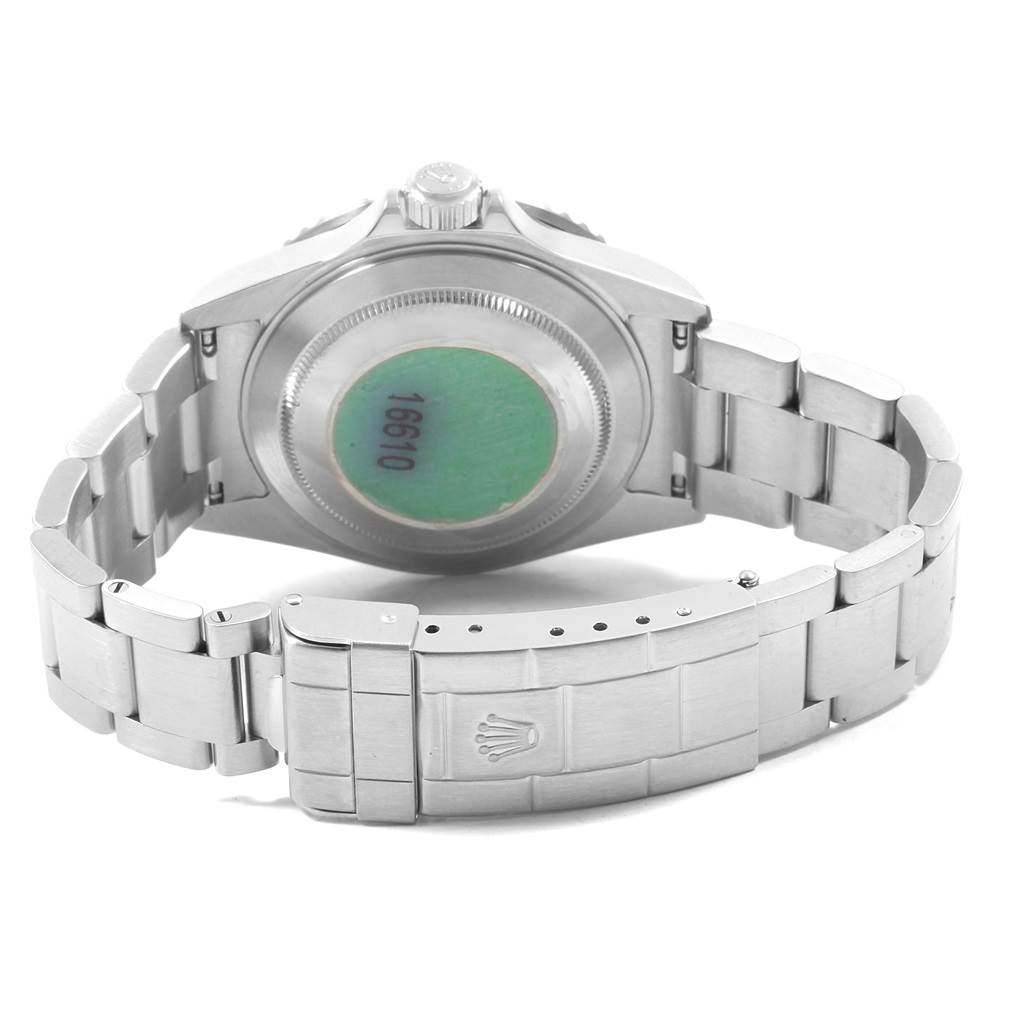 This image shows the back side, bracelet, and clasp of a Rolex Submariner 16610 Men's Stainless Steel Black Dial 16610 Men's Stainless Steel Black Dial watch.